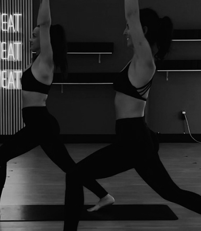 Fire Flow Sculpt & Tone Teacher Training - two instructors with dumbbells